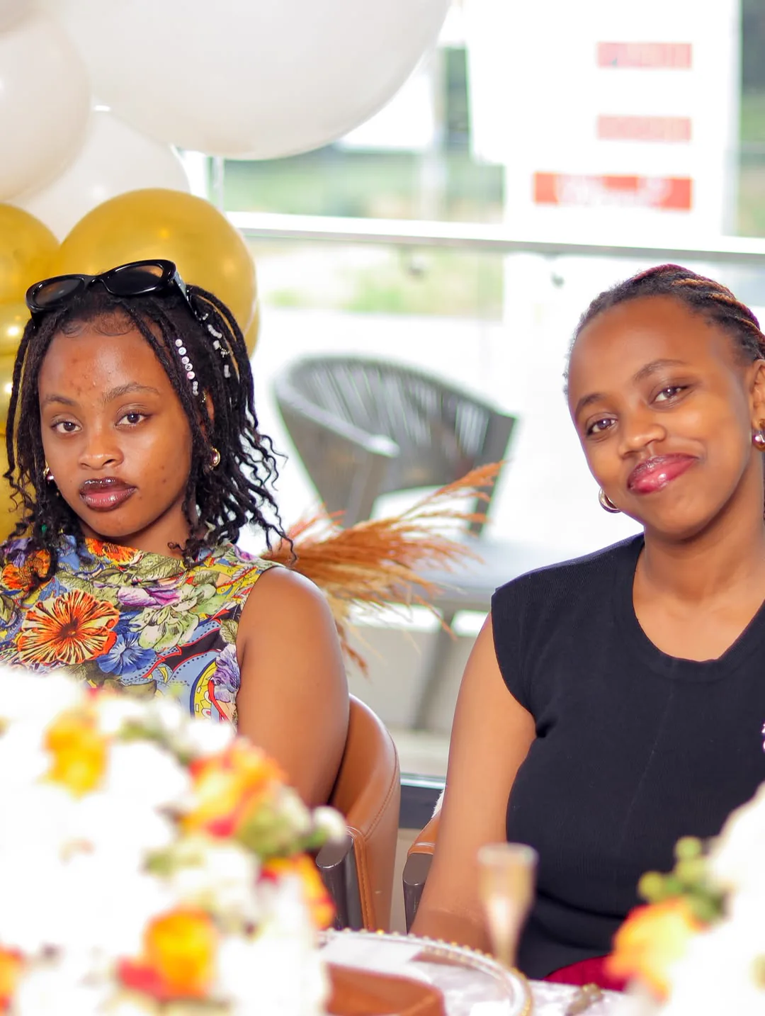 Moreen sharing a warm moment with a friend at a celebration